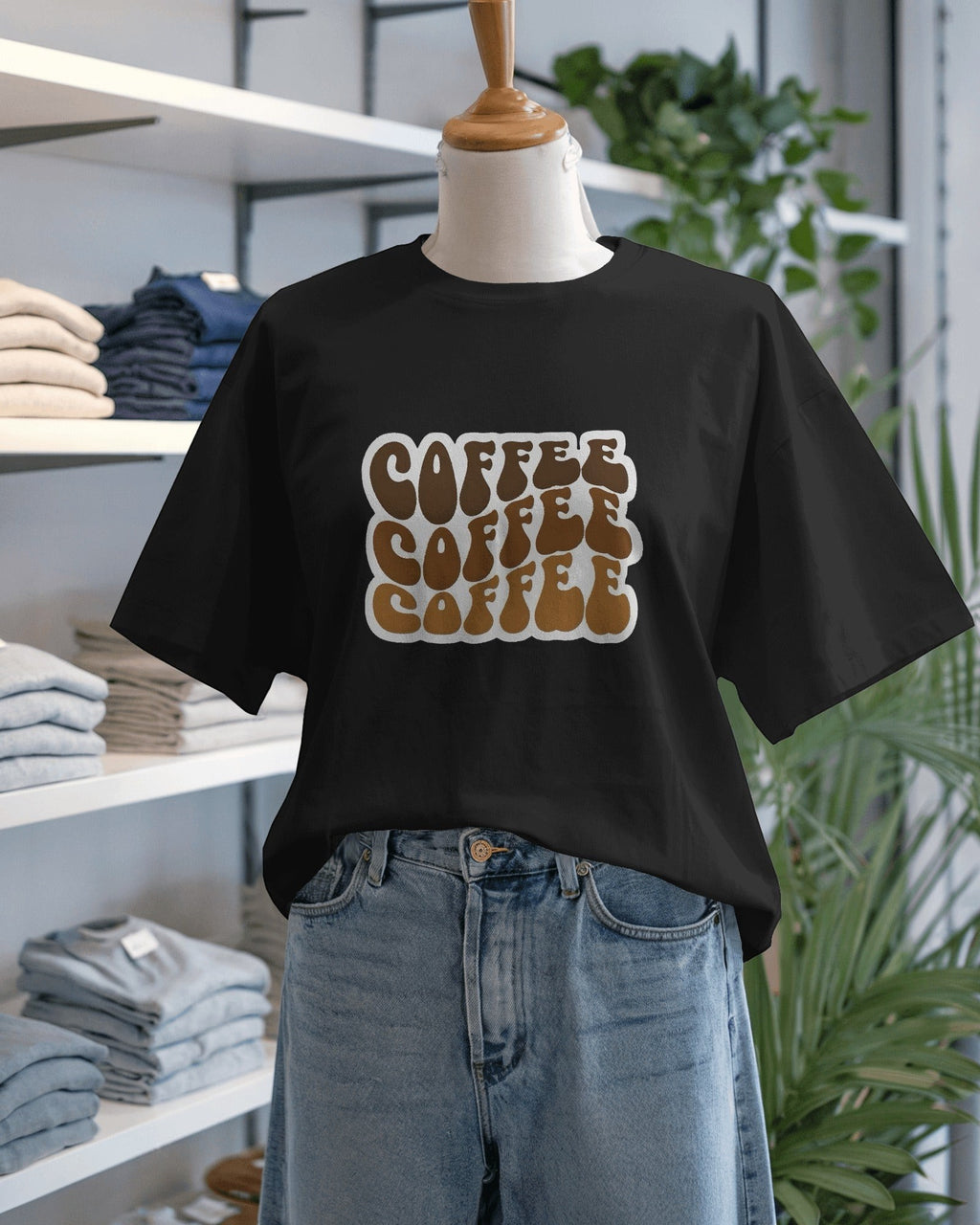Snubclub black oversized t-shirt with a stacked "COFFEE" graphic in brown and white.
